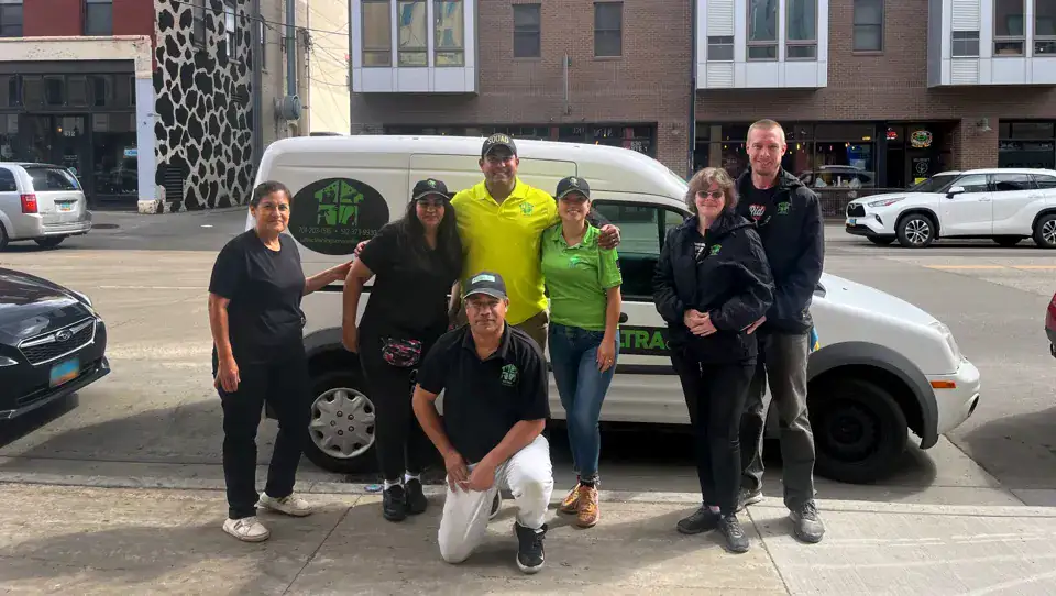 Original Ultra Cleaning Services group photograph near a company vehicle